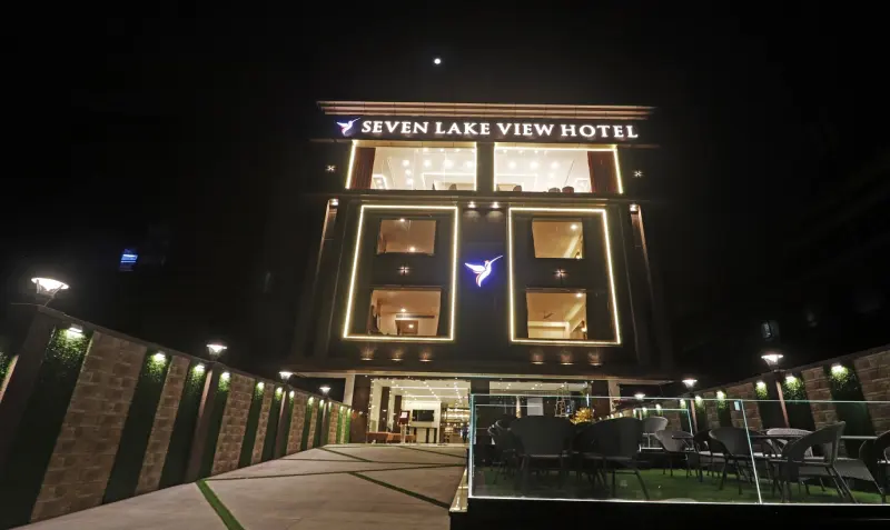 Seven Lake View Hotel illuminated at night